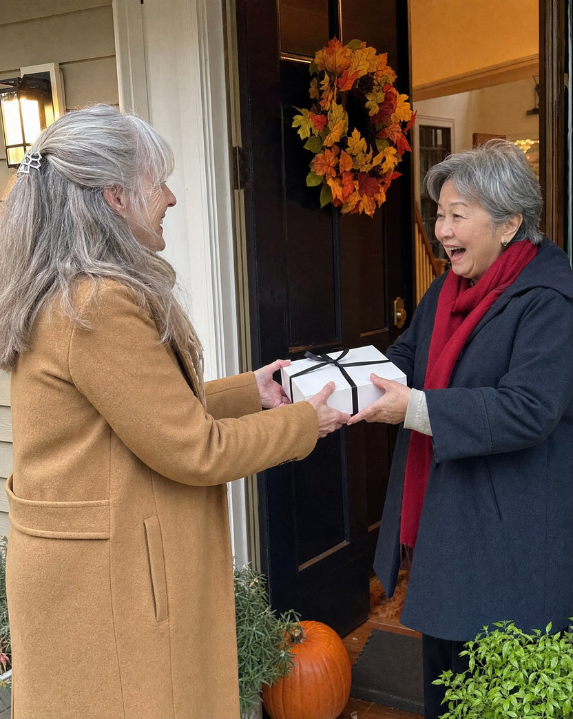 Handing over an Avor gift at the front door